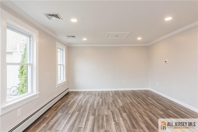 empty room featuring hardwood / wood-style floors, ornamental molding, and a baseboard radiator