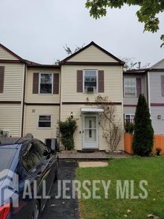 view of front of home with fence and a front yard