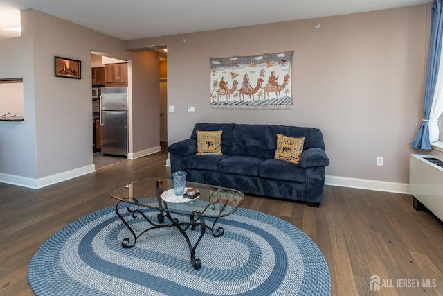 living room with dark hardwood / wood-style floors