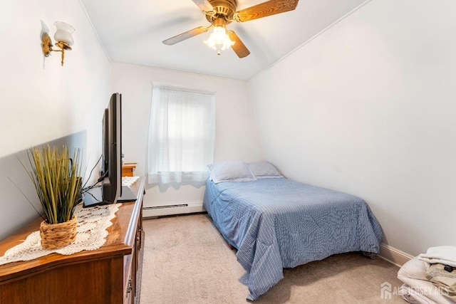 bedroom with a baseboard radiator, carpet floors, a ceiling fan, and baseboards