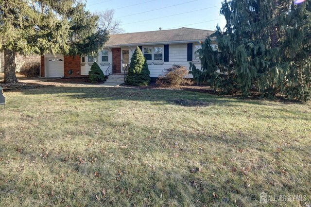 ranch-style house with a front yard and a garage