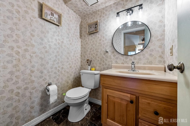 8 Carlisle Ct, Old Bridge, NJ 08857 - bathroom with marble finish flooring, vanity, toilet, baseboards, and wallpapered walls
