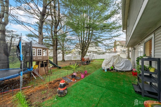 8 Carlisle Ct, Old Bridge, NJ 08857 - view of yard with a trampoline and a playground