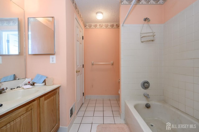 23 Newburgh Dr, Edison, NJ 08820 - bathroom featuring vanity, tile patterned floors, a textured ceiling, and washtub / shower combination