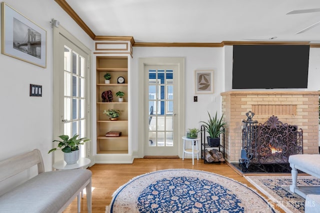 1135 Dorsey Pl, Plainfield, NJ 07062 - living room with light wood finished floors, ornamental molding, a brick fireplace, built in features, and a ceiling fan