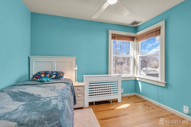 1135 Dorsey Pl, Plainfield, NJ 07062 - bedroom with wood finished floors, ceiling fan, and baseboards