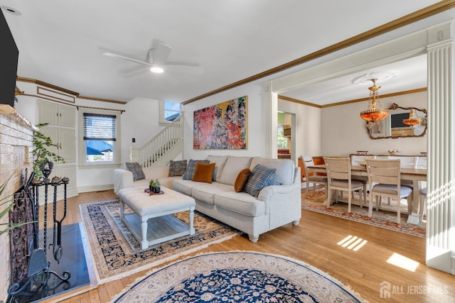 1135 Dorsey Pl, Plainfield, NJ 07062 - living area featuring crown molding, a ceiling fan, light wood-style floors, stairway, and baseboards