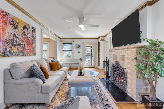 1135 Dorsey Pl, Plainfield, NJ 07062 - living area featuring crown molding, a fireplace, ceiling fan, wood finished floors, and baseboards