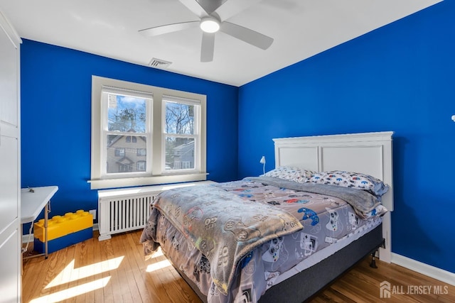 1135 Dorsey Pl, Plainfield, NJ 07062 - bedroom featuring hardwood / wood-style floors, radiator heating unit, baseboards, and a ceiling fan