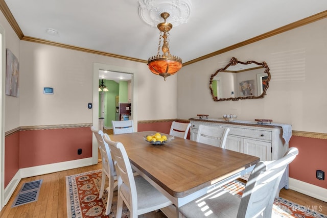 1135 Dorsey Pl, Plainfield, NJ 07062 - dining space with baseboards, light wood-style flooring, and ornamental molding