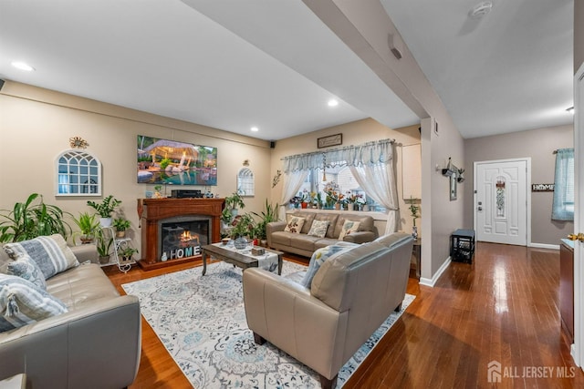 80 Sonora Ave, Iselin, NJ 08830 - living area featuring dark wood finished floors, a glass covered fireplace, baseboards, and recessed lighting
