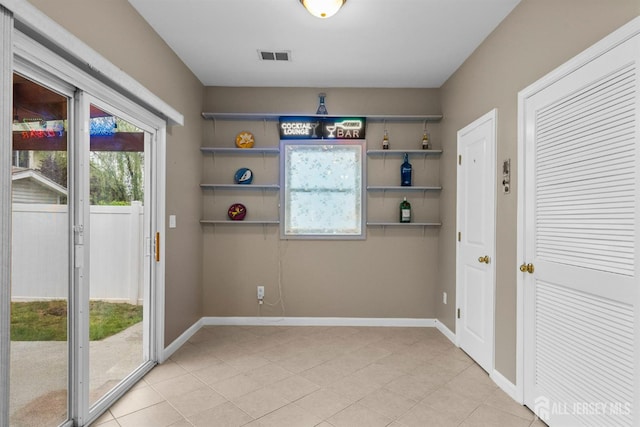 80 Sonora Ave, Iselin, NJ 08830 - unfurnished dining area with plenty of natural light, baseboards, and light tile patterned floors