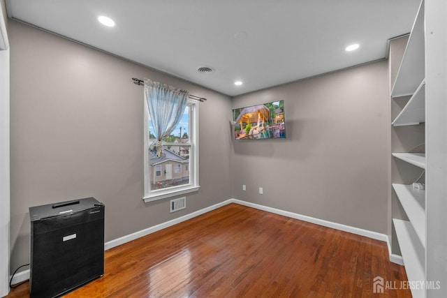 80 Sonora Ave, Iselin, NJ 08830 - empty room with wood finished floors, baseboards, and recessed lighting