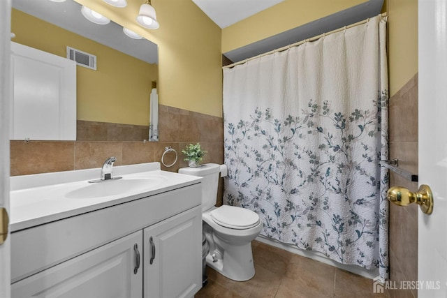 80 Sonora Ave, Iselin, NJ 08830 - bathroom with vanity, toilet, tile patterned flooring, curtained shower, and tile walls
