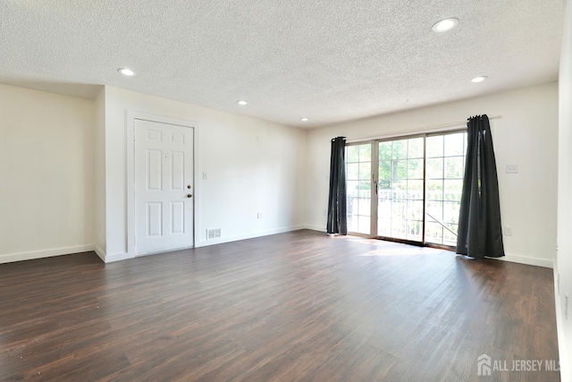 33 Rachel Ct, Franklin Twsp, NJ 08823 - empty room with a textured ceiling, dark wood finished floors, recessed lighting, and baseboards