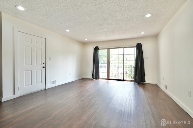 33 Rachel Ct, Franklin Twsp, NJ 08823 - unfurnished room featuring a textured ceiling, dark wood-style flooring, recessed lighting, and baseboards