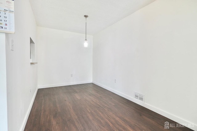 33 Rachel Ct, Franklin Twsp, NJ 08823 - empty room featuring dark wood finished floors and baseboards