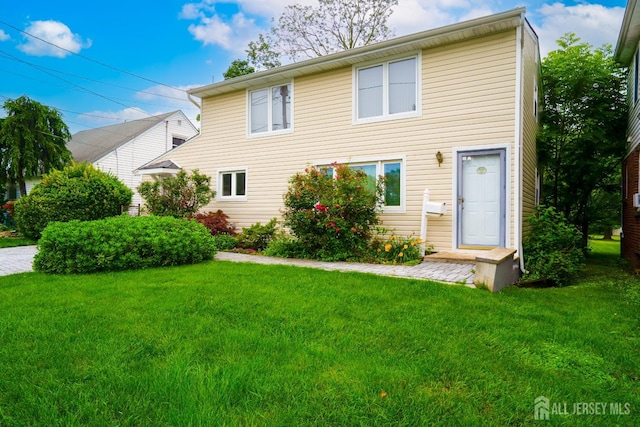 314 Benjamin Ave, Iselin, NJ 08830 - rear view of house featuring a lawn