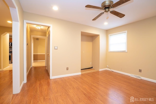 314 Benjamin Ave, Iselin, NJ 08830 - unfurnished bedroom with light wood-type flooring, arched walkways, and recessed lighting