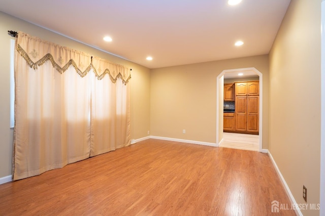 314 Benjamin Ave, Iselin, NJ 08830 - empty room with light wood-type flooring, recessed lighting, and arched walkways