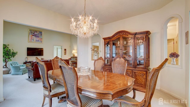 39 Leeds Ln, Monroe, NJ 08831 - dining space featuring light colored carpet, a chandelier, and arched walkways