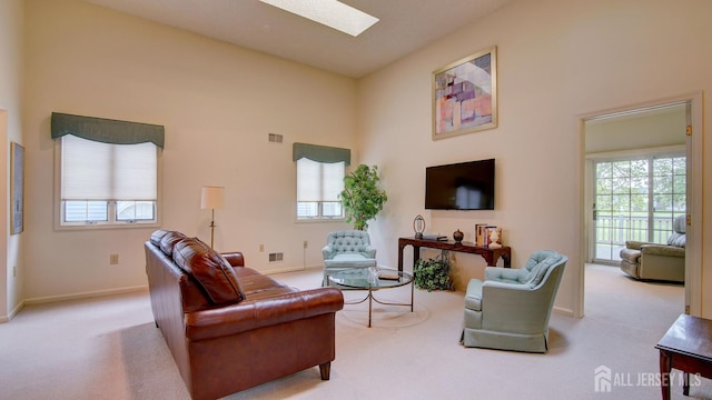 39 Leeds Ln, Monroe, NJ 08831 - living room with carpet flooring, healthy amount of natural light, a high ceiling, and a skylight