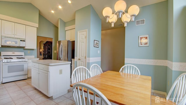 39 Leeds Ln, Monroe, NJ 08831 - kitchen with white appliances, a chandelier, white cabinetry, light countertops, and lofted ceiling