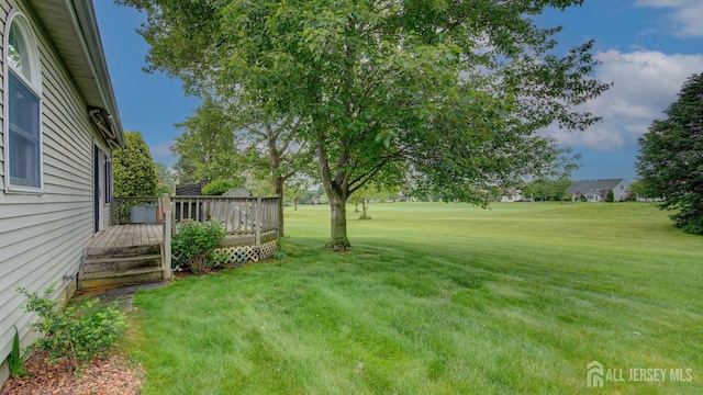 39 Leeds Ln, Monroe, NJ 08831 - view of green lawn with a deck