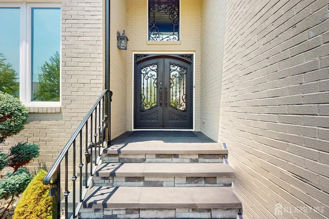 9 Helene St, Old Bridge, NJ 08857 - doorway to property featuring french doors and brick siding