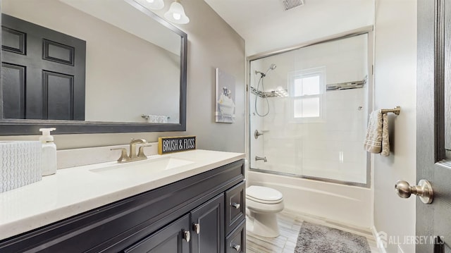 9 Helene St, Old Bridge, NJ 08857 - bathroom with toilet, vanity, and bath / shower combo with glass door