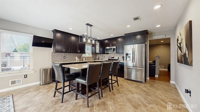 9 Helene St, Old Bridge, NJ 08857 - kitchen with appliances with stainless steel finishes, healthy amount of natural light, a kitchen island, baseboards, and recessed lighting