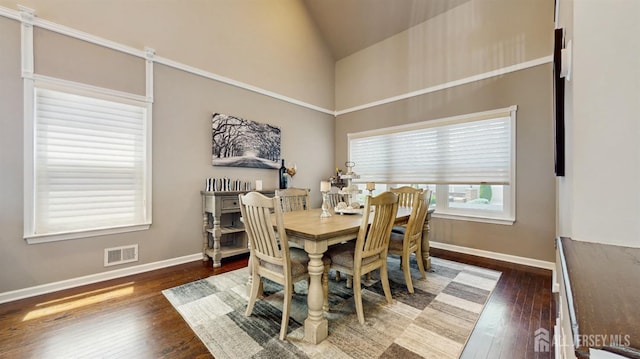 9 Helene St, Old Bridge, NJ 08857 - dining area with baseboards, wood finished floors, and lofted ceiling
