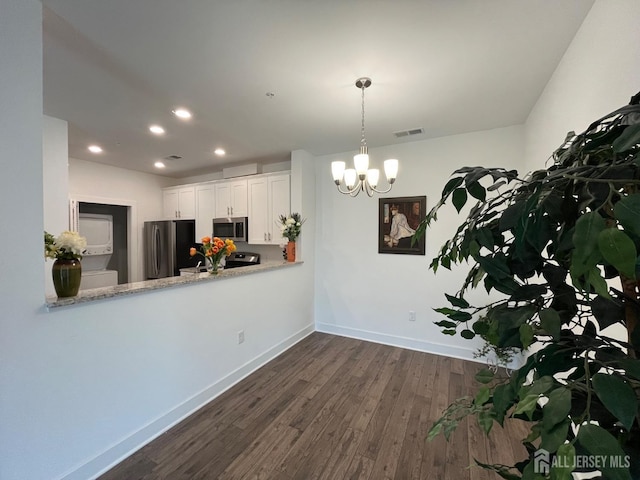 812 Stiller Ln, Monroe, NJ 08831 - kitchen with appliances with stainless steel finishes, dark wood finished floors, baseboards, recessed lighting, and a chandelier
