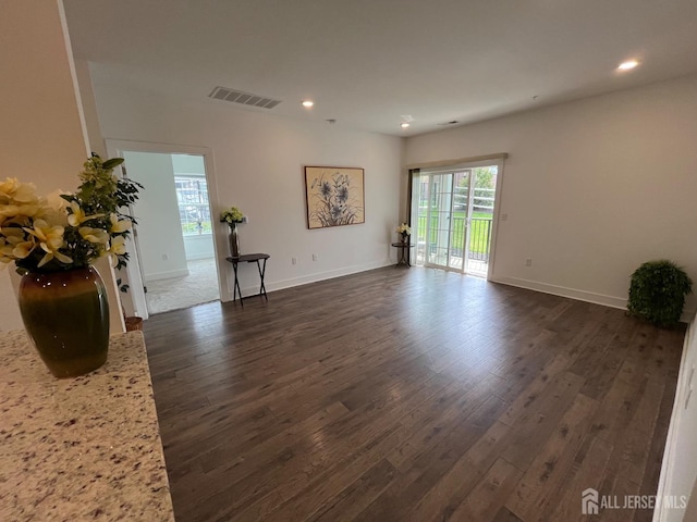 812 Stiller Ln, Monroe, NJ 08831 - unfurnished living room featuring healthy amount of natural light, recessed lighting, dark wood-type flooring, and baseboards