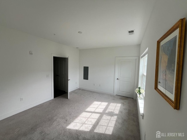 812 Stiller Ln, Monroe, NJ 08831 - unfurnished bedroom featuring light carpet, electric panel, and baseboards