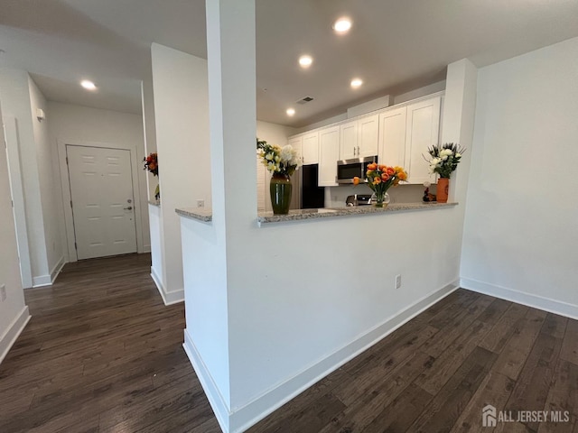 812 Stiller Ln, Monroe, NJ 08831 - kitchen featuring stainless steel microwave, freestanding refrigerator, dark wood finished floors, recessed lighting, and baseboards