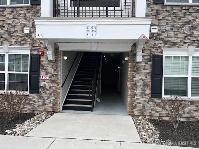 812 Stiller Ln, Monroe, NJ 08831 - view of exterior entry with stone siding and a balcony