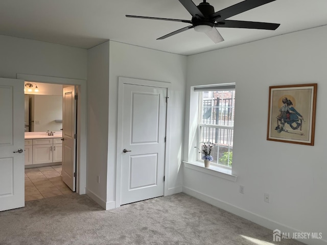 812 Stiller Ln, Monroe, NJ 08831 - unfurnished bedroom featuring light carpet, multiple windows, a sink, and connected bathroom