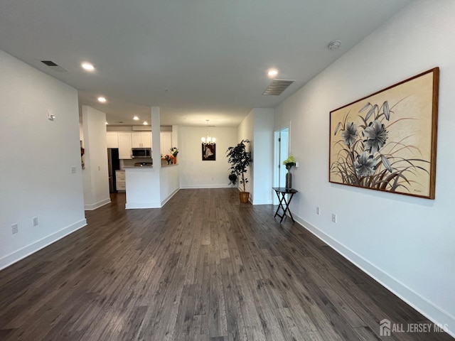 812 Stiller Ln, Monroe, NJ 08831 - unfurnished living room featuring a chandelier, dark wood-type flooring, recessed lighting, and baseboards