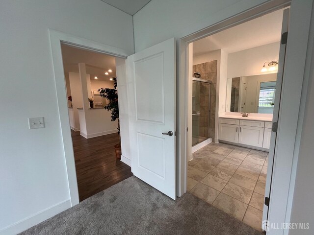 812 Stiller Ln, Monroe, NJ 08831 - full bathroom with a shower stall, a spacious closet, vanity, and baseboards
