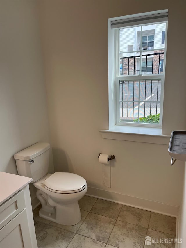 812 Stiller Ln, Monroe, NJ 08831 - bathroom with toilet, plenty of natural light, baseboards, and vanity