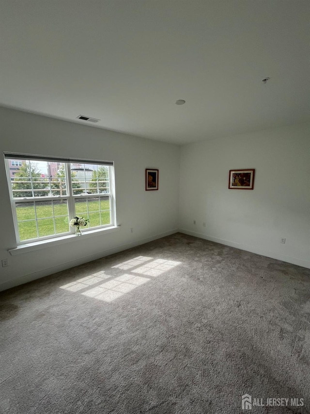 812 Stiller Ln, Monroe, NJ 08831 - carpeted empty room with fire sprinkler in ceiling and baseboards