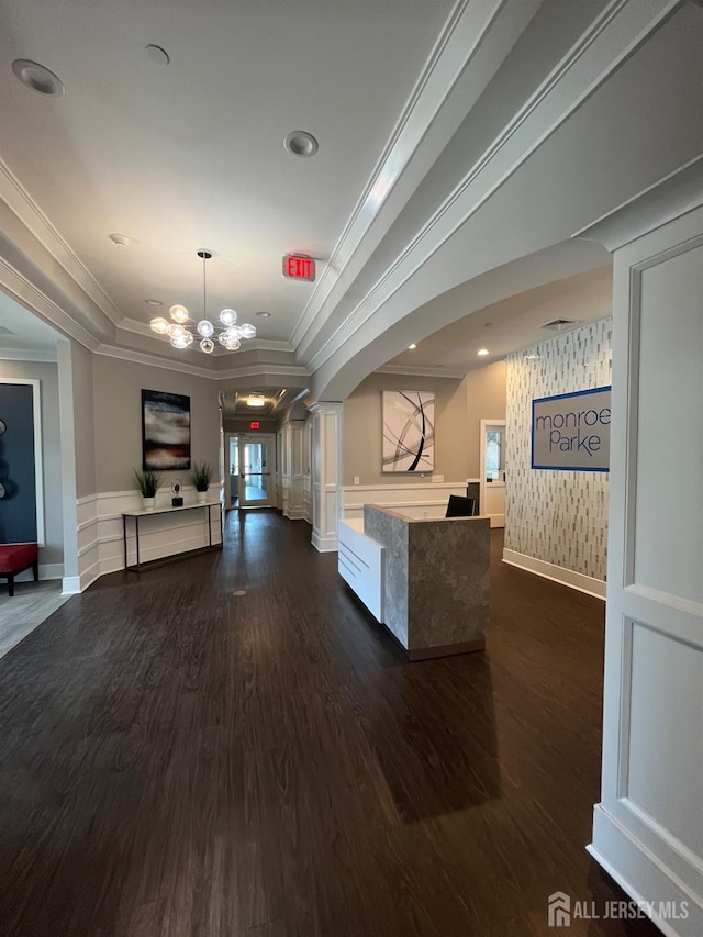 812 Stiller Ln, Monroe, NJ 08831 - reception area featuring ornate columns, crown molding, arched walkways, wainscoting, and a chandelier