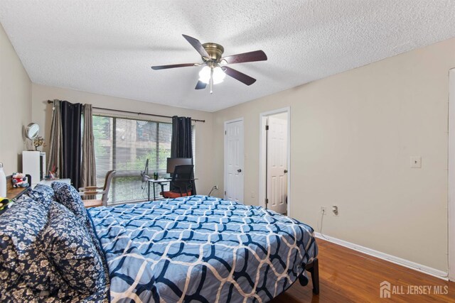 320 Willowbrook Dr, North Brunswick, NJ 08902 - bedroom with wood finished floors, a textured ceiling, and ceiling fan