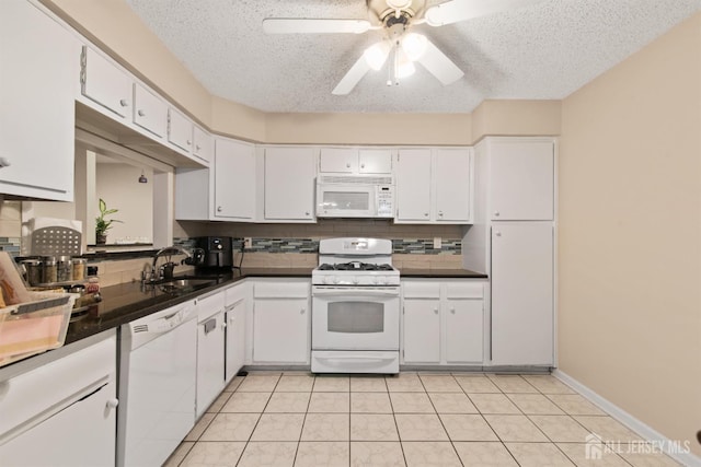 320 Willowbrook Dr, North Brunswick, NJ 08902 - kitchen featuring white appliances, dark countertops, decorative backsplash, white cabinets, and a textured ceiling
