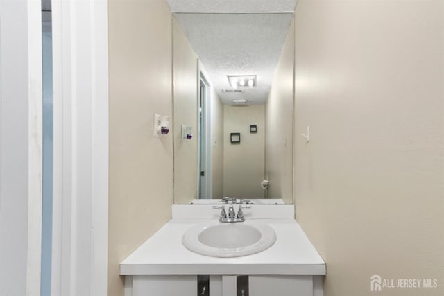 320 Willowbrook Dr, North Brunswick, NJ 08902 - bathroom with a textured ceiling and vanity