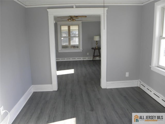 5 E Kupsch St, Sayreville, NJ 08872 - spare room with baseboards, dark wood-style floors, crown molding, baseboard heating, and ceiling fan