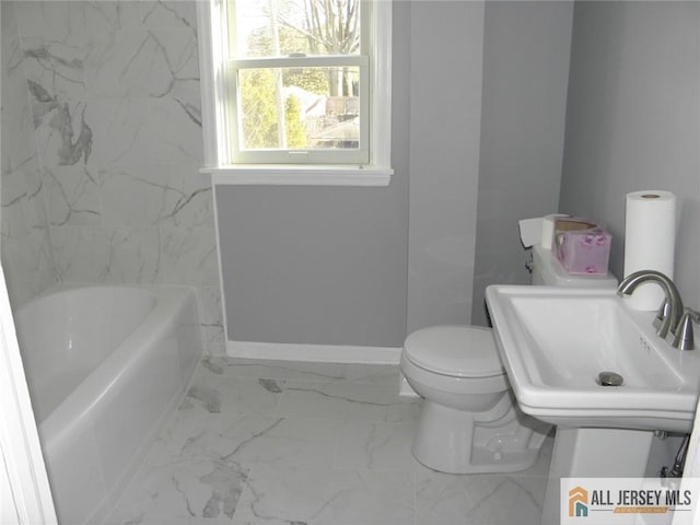 5 E Kupsch St, Sayreville, NJ 08872 - full bath with toilet, a tub to relax in, marble look tile flooring, baseboards, and a sink