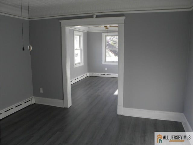 5 E Kupsch St, Sayreville, NJ 08872 - spare room with dark wood-style floors, baseboards, and a baseboard radiator
