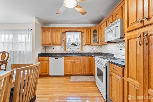 44 Pleasant Ave, Iselin, NJ 08830 - kitchen featuring white appliances, ceiling fan, crown molding, light wood-style floors, and backsplash